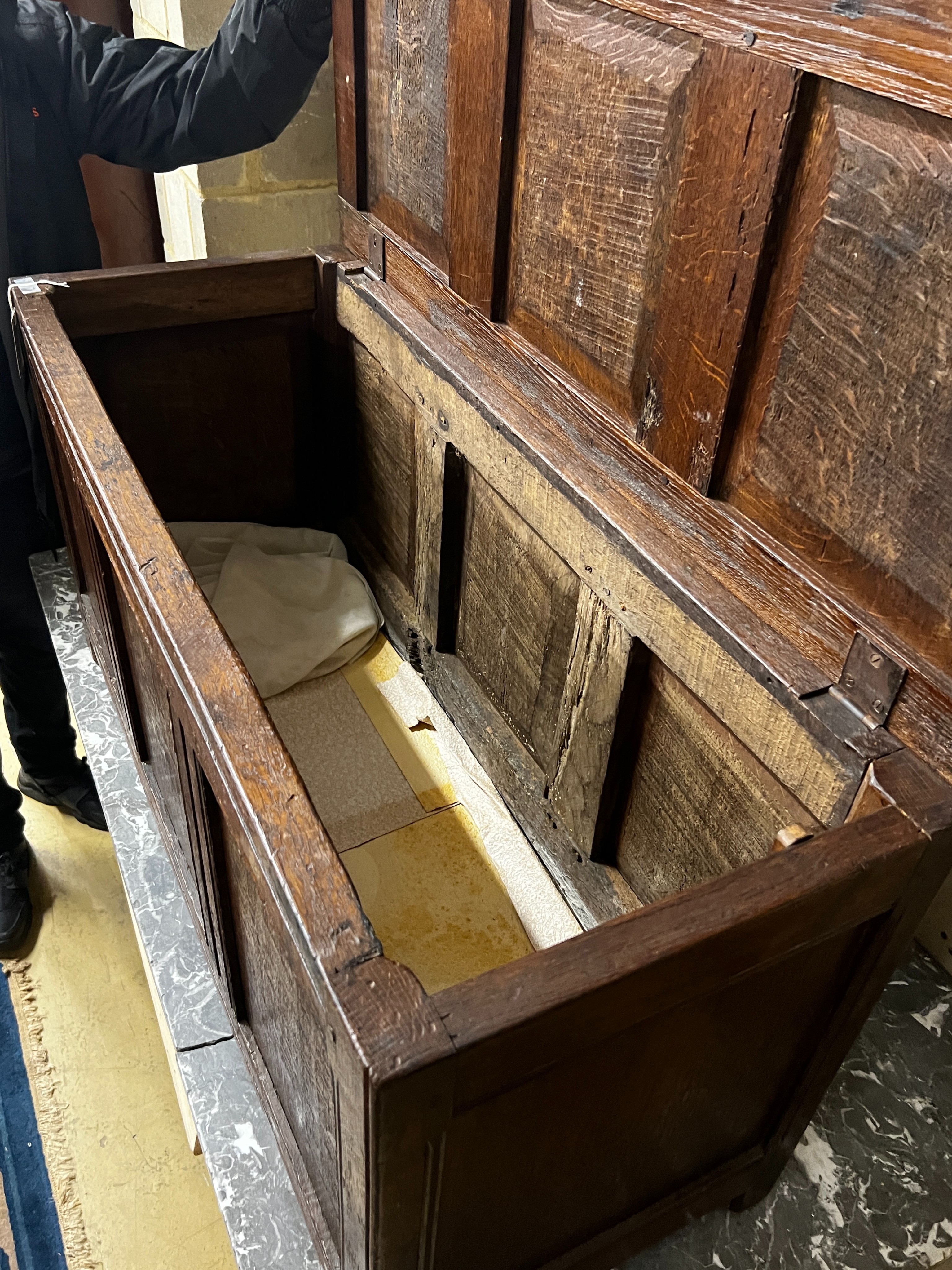 An early 18th century and later panelled oak coffer, length 108cm, depth 43cm, height 57cm